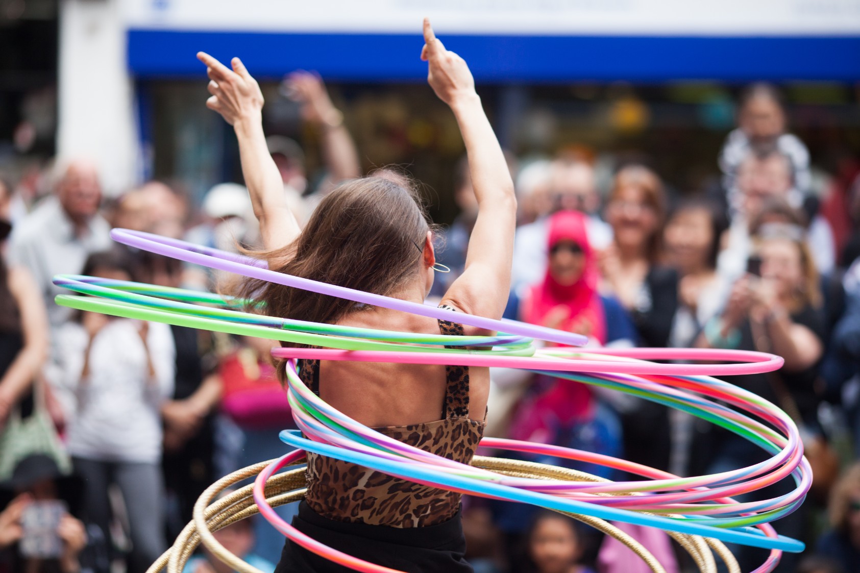 A lady playing with hula-hoops
